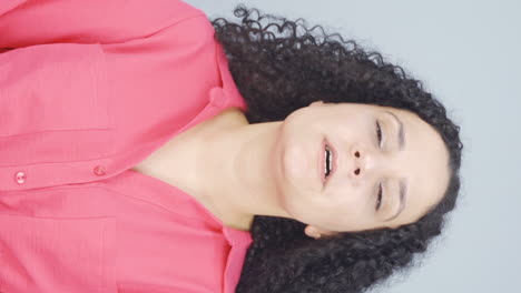 Vertical-video-of-The-sneezing-young-woman.-Patient.